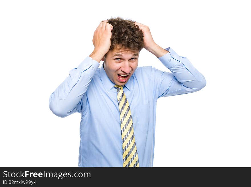 Young attractive young male, wearing blue shirt and yellow necktie, tears his hairs out, studio shoot isolated on white background. Young attractive young male, wearing blue shirt and yellow necktie, tears his hairs out, studio shoot isolated on white background