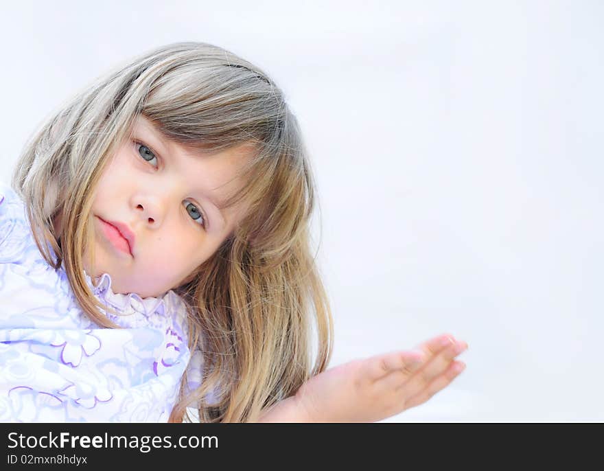 Cute little girl posing in studio