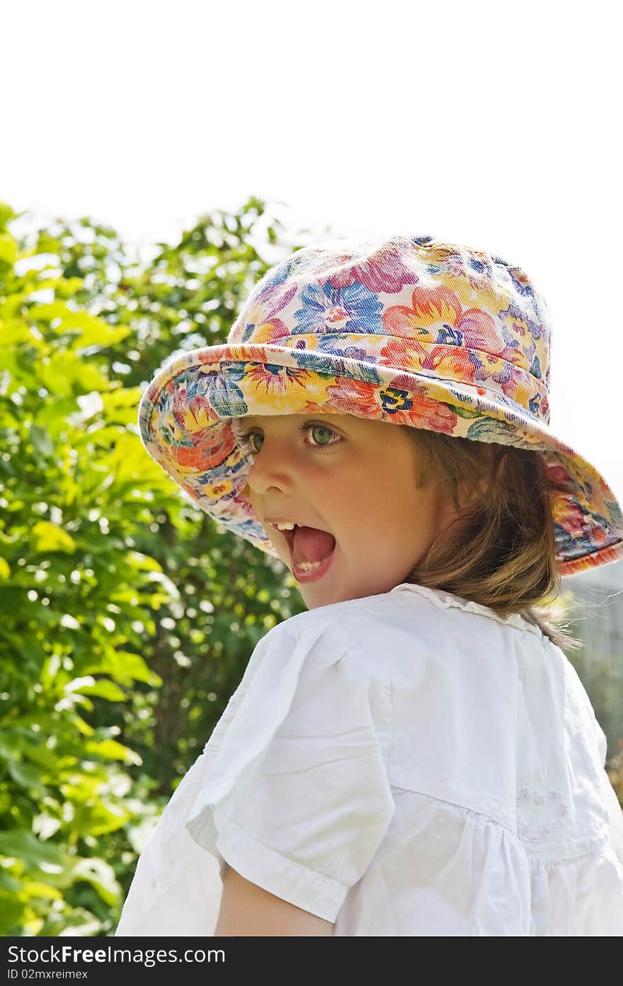 Portrait Of Three Years Old Girl In The Garden