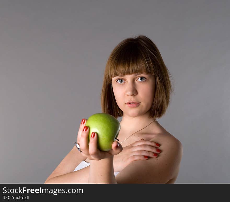 Woman with apple studio shot