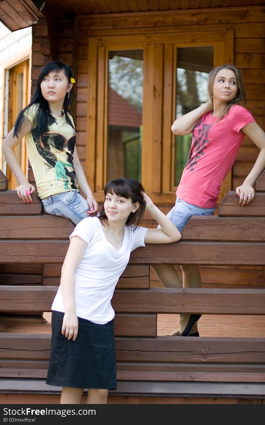 Three female friends on a veranda