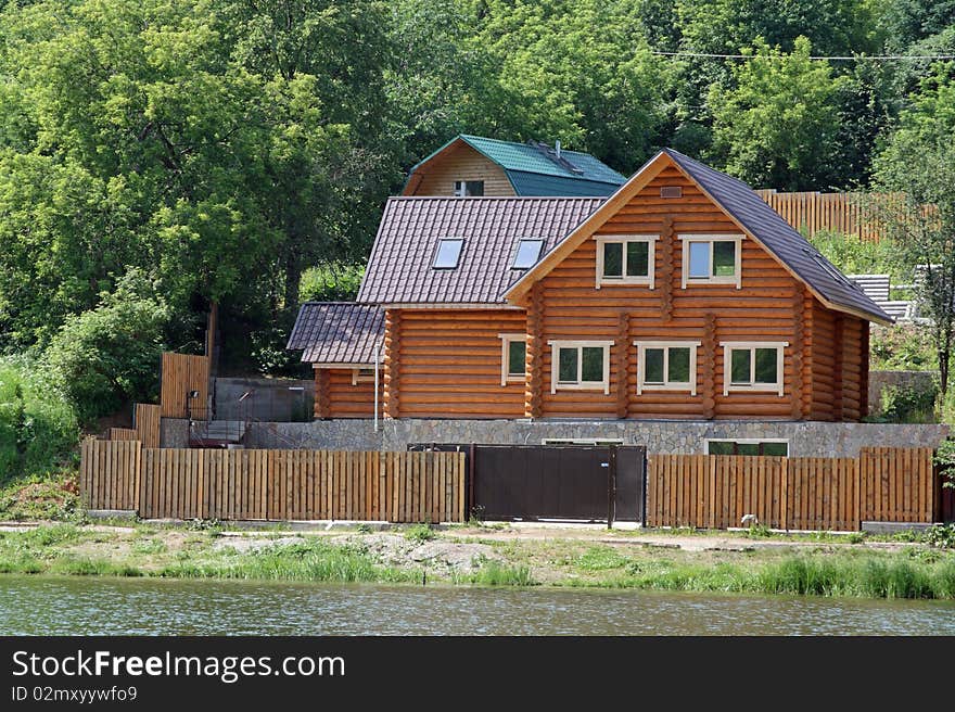 The wooden house on the bank of lake