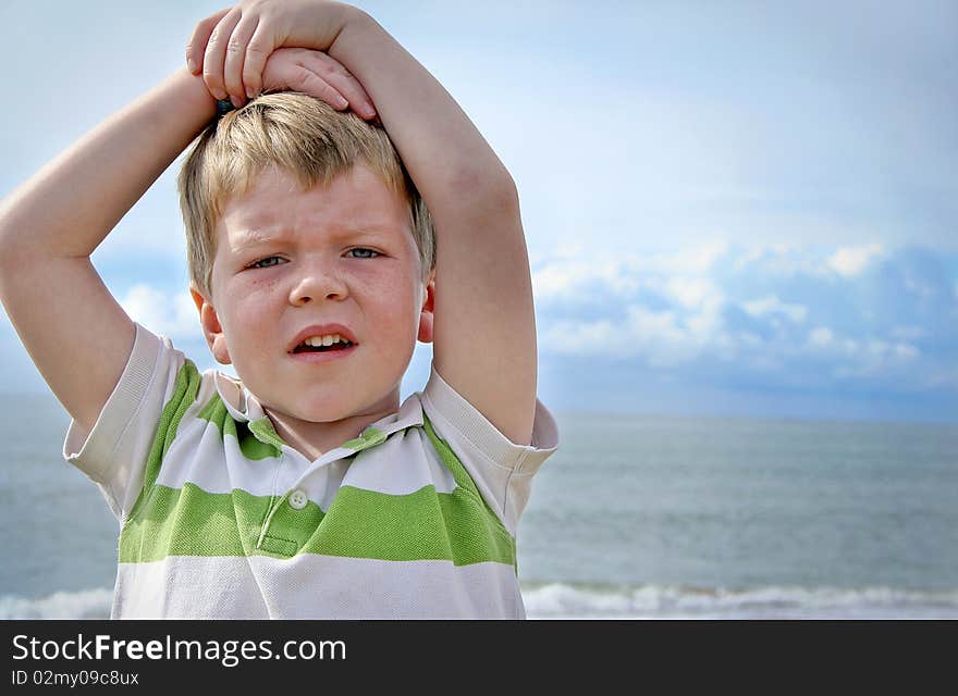 Boy at sunny beach