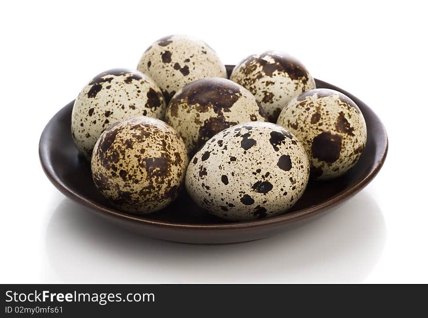 Quail eggs isolated on white