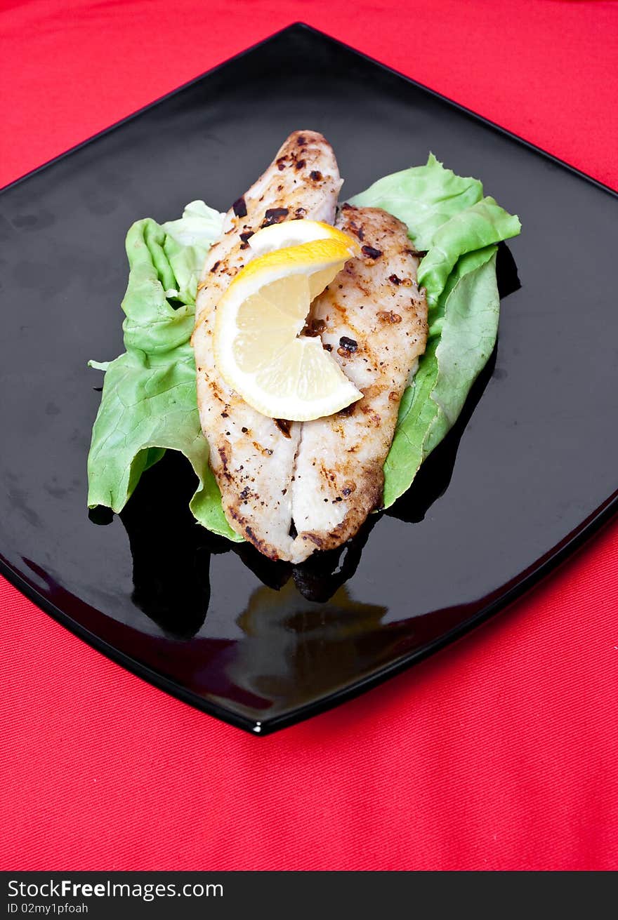 Grilled fish with fresh lemon juice