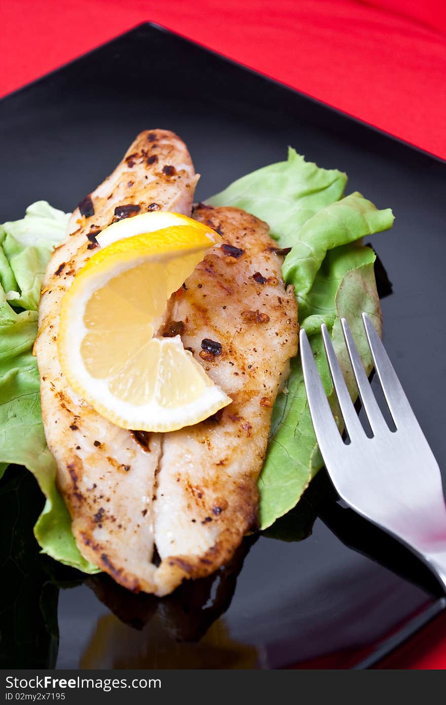 Grilled fish with fresh lemon juice