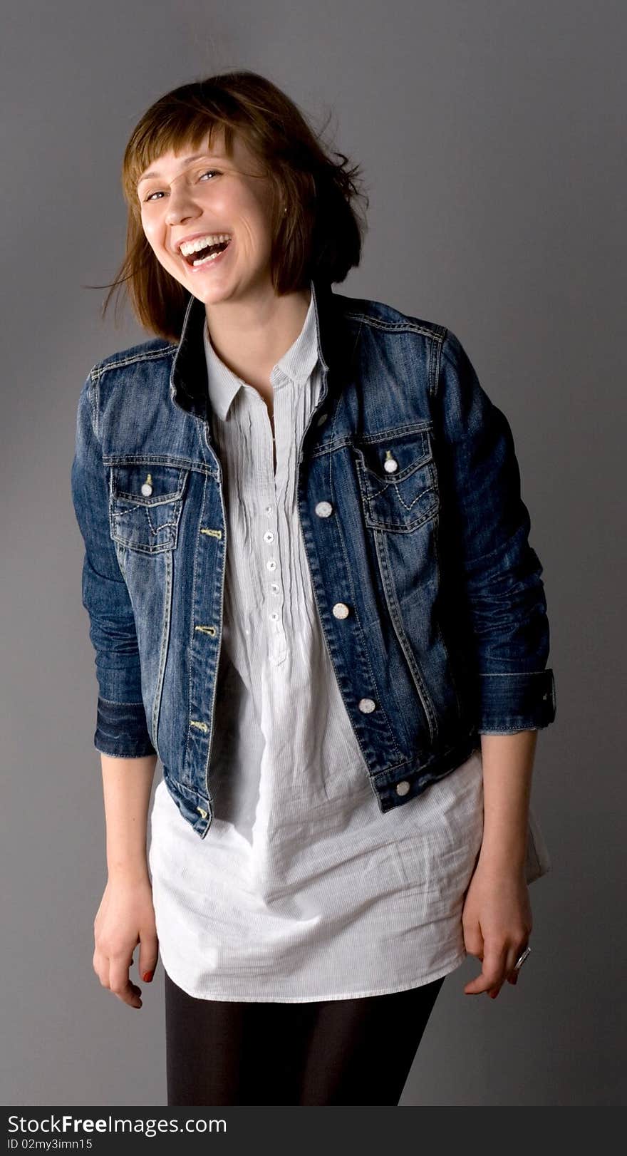 Laughing woman posing in studio