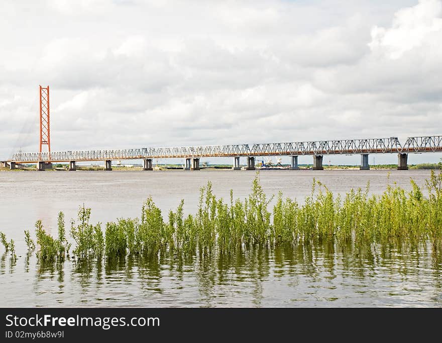 The bridge through the river Ob. The bridge through the river Ob