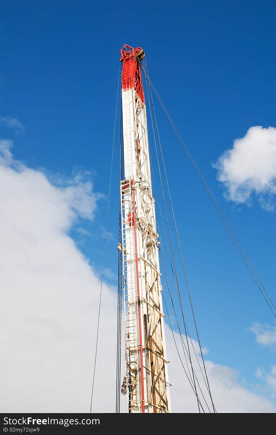 Mast on a background of the blue sky and rocking chairs. Mast on a background of the blue sky and rocking chairs