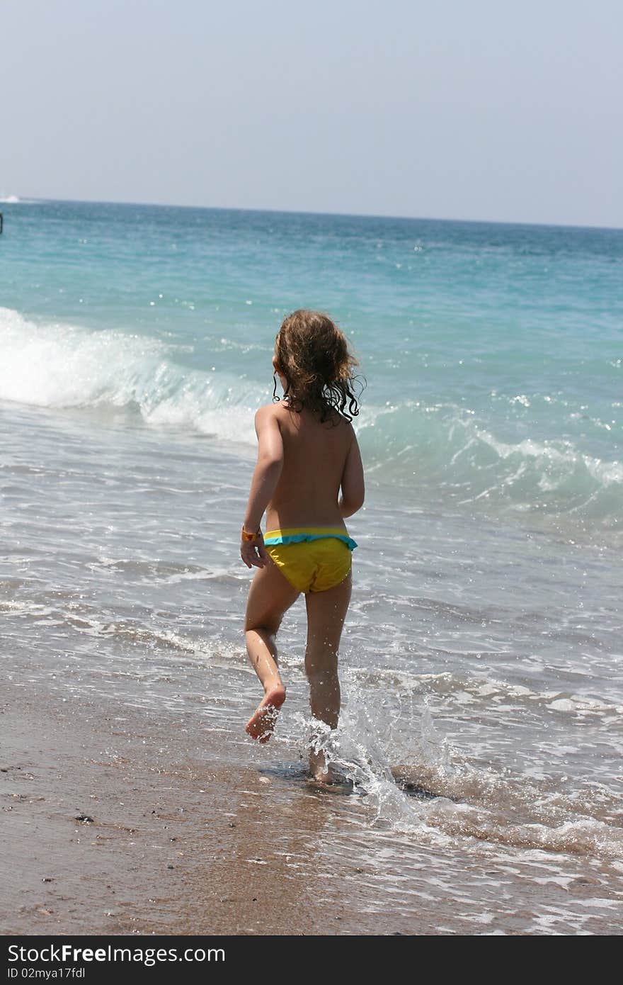 Child Runs On Coast The Sea