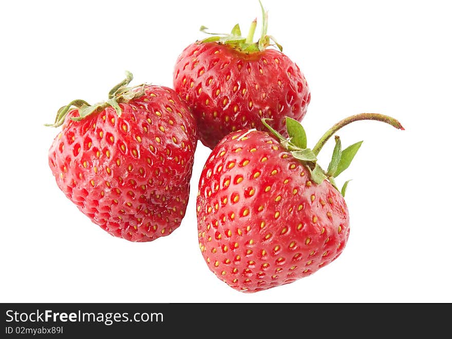 Three ripe strawberry on white