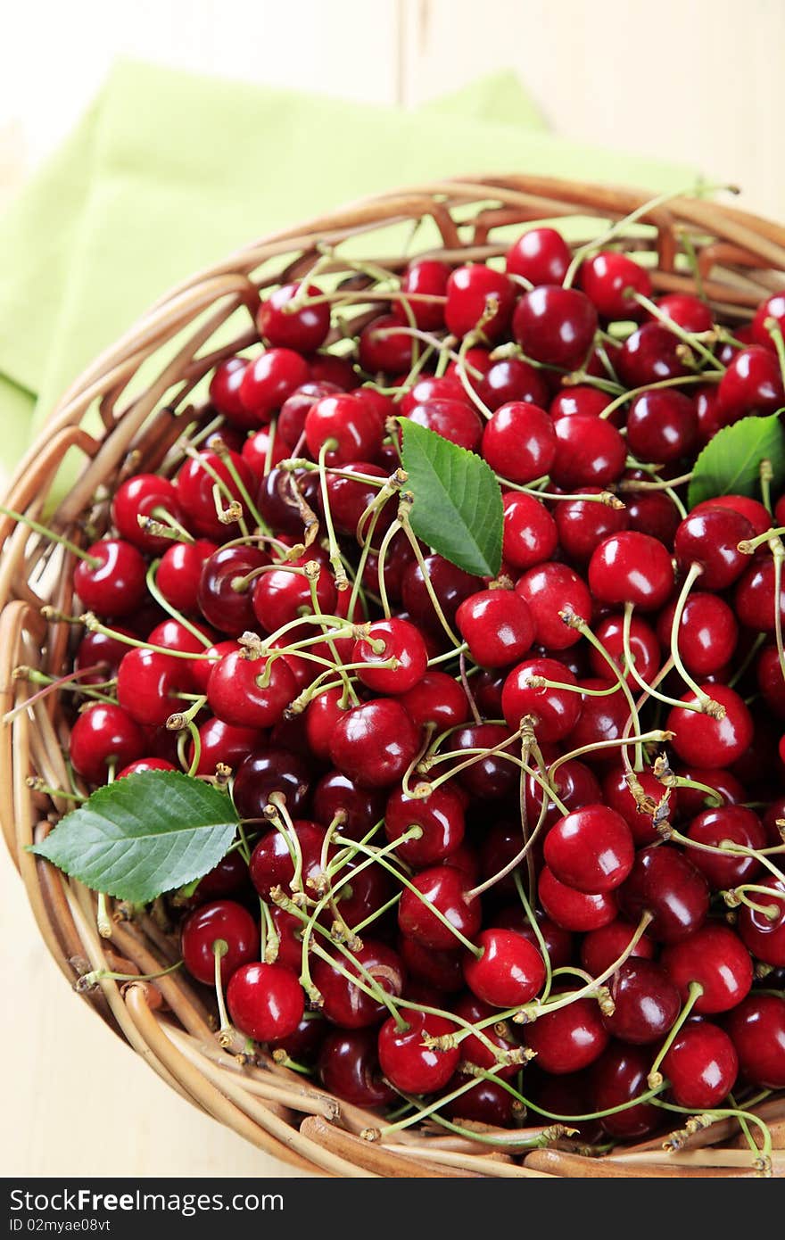 Fresh red cherries in a basket