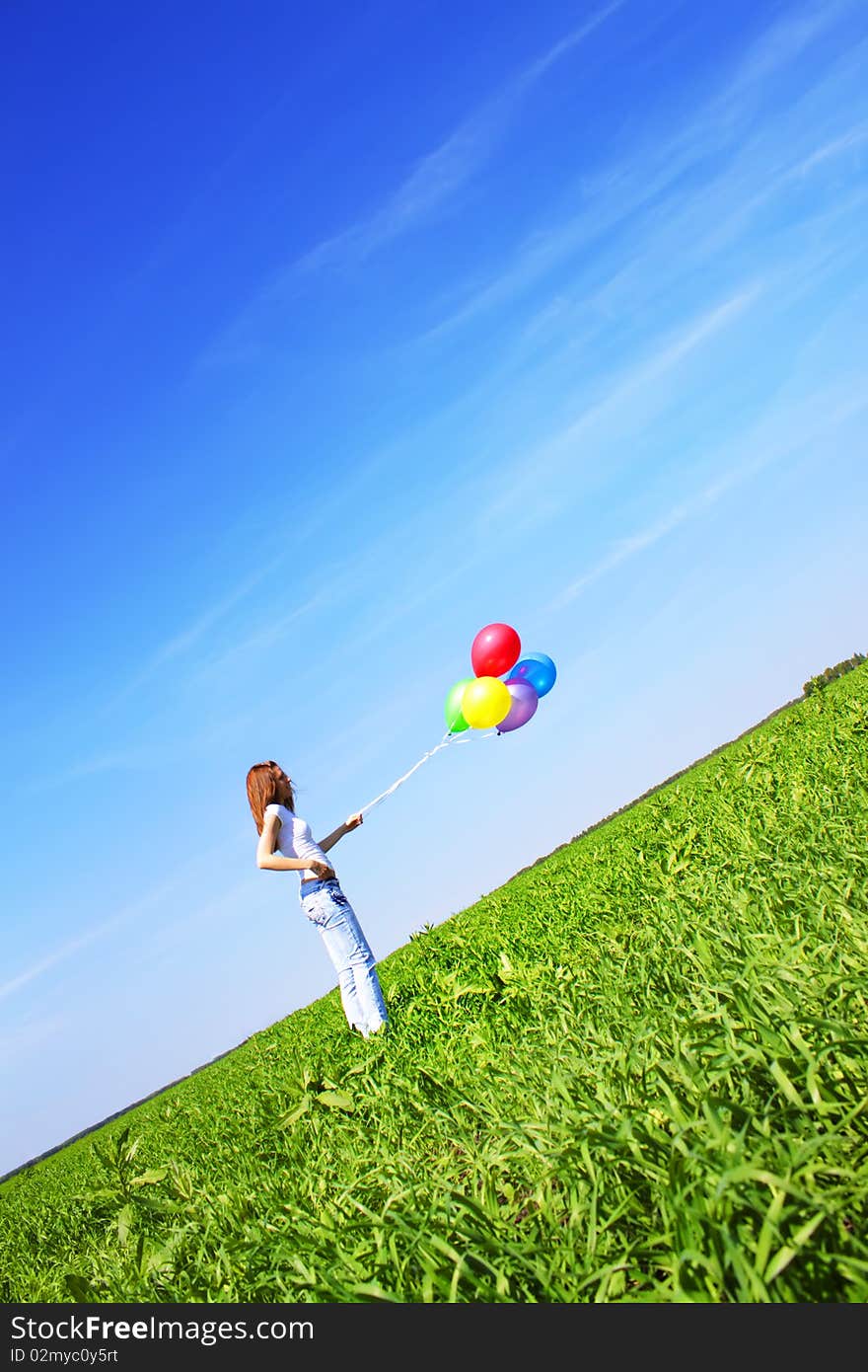 Girl and balloons on a blue background