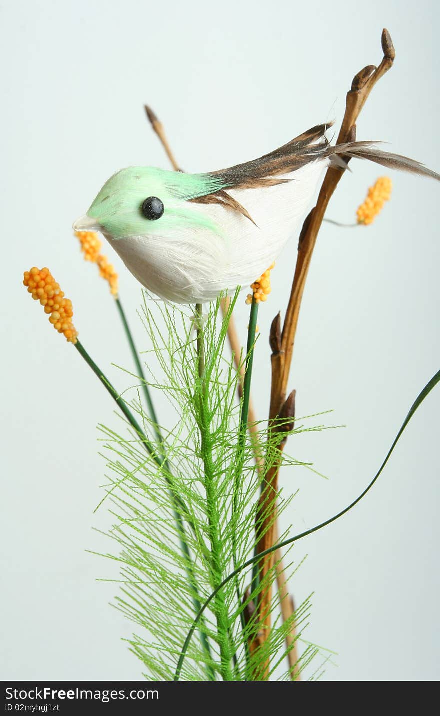 Decorative bird on branch on white background