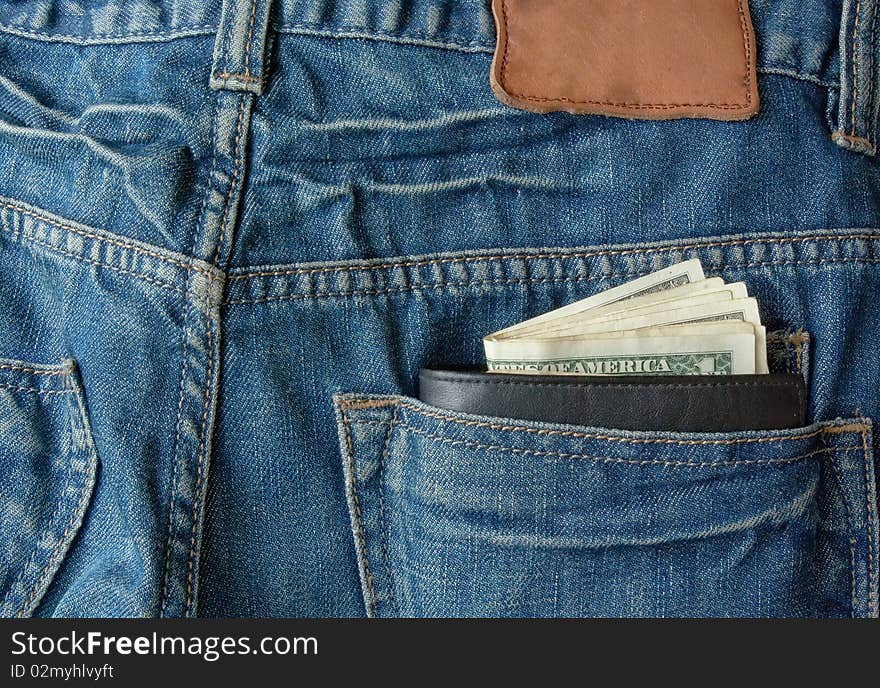 Money with purse in back pocket