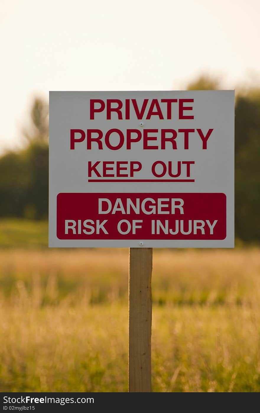 Private property sign warning of danger in english countryside. Private property sign warning of danger in english countryside