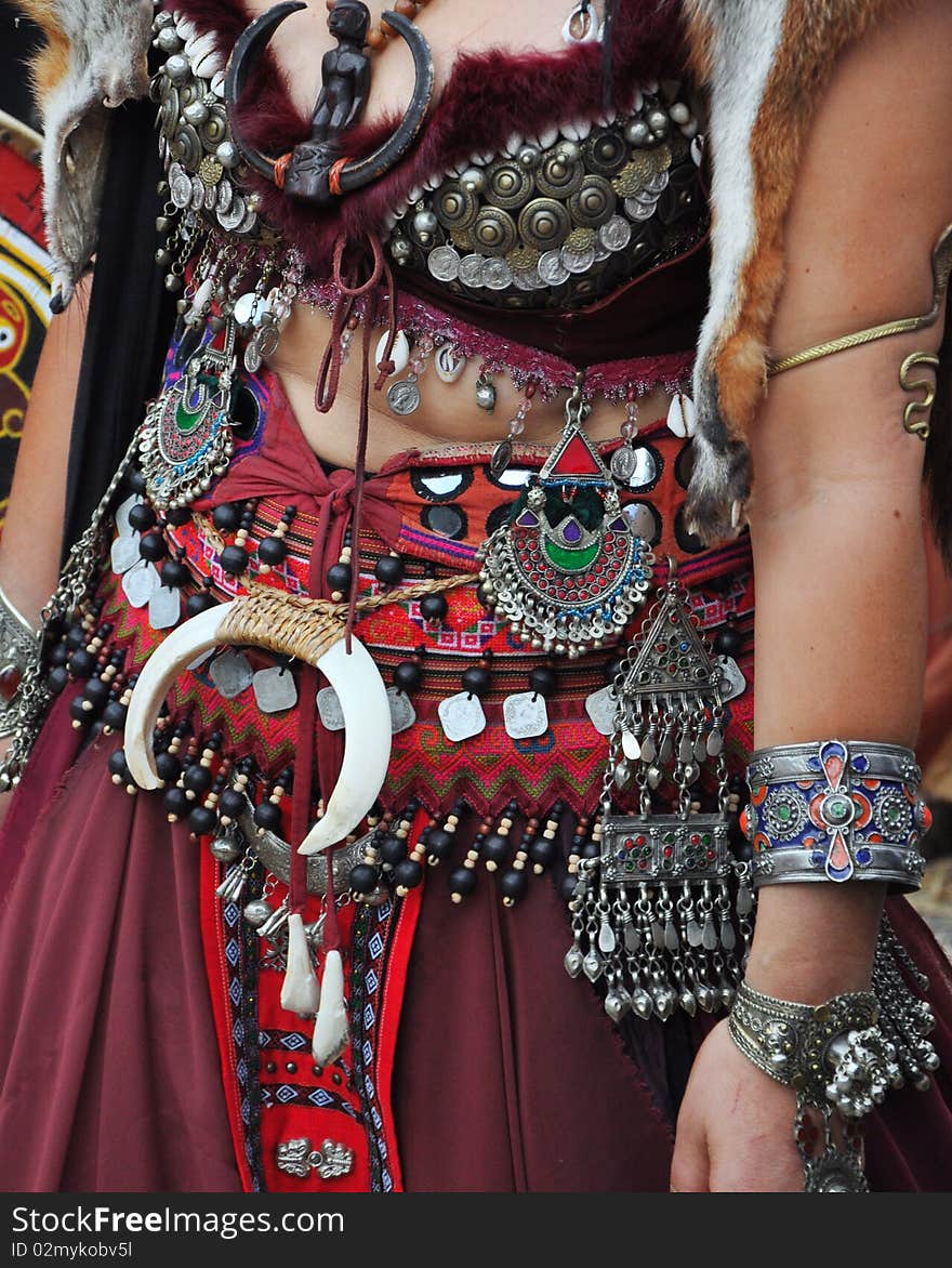 A woman dressing a medieval clothes and accessories. A woman dressing a medieval clothes and accessories