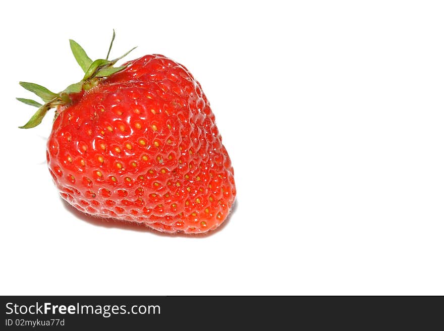 A fresh strawberry on a white background. A fresh strawberry on a white background