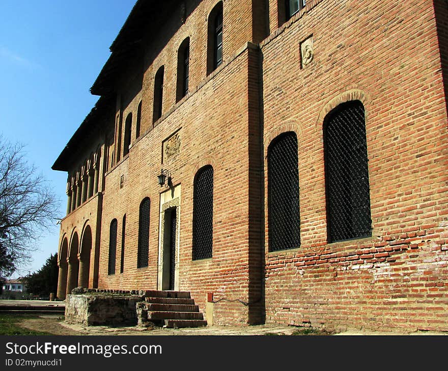 Old mansion facade with a lot of windows.