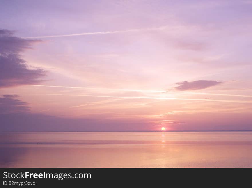 Sunbeams emanating from behind a clouds at surise. Sunbeams emanating from behind a clouds at surise