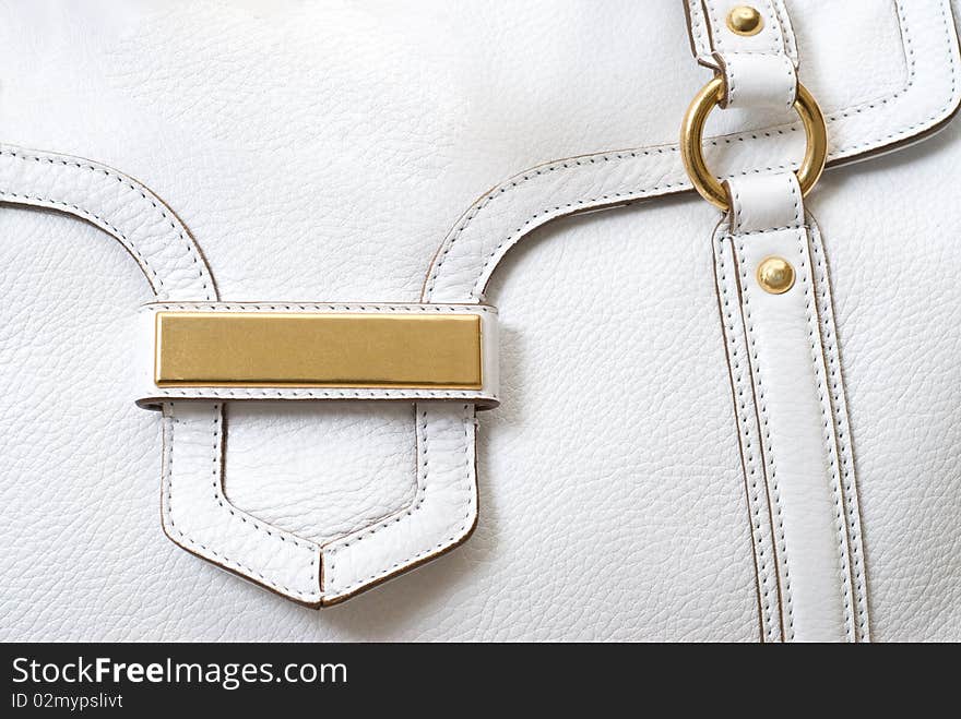 Macro of luxury white leather female bag. Macro of luxury white leather female bag