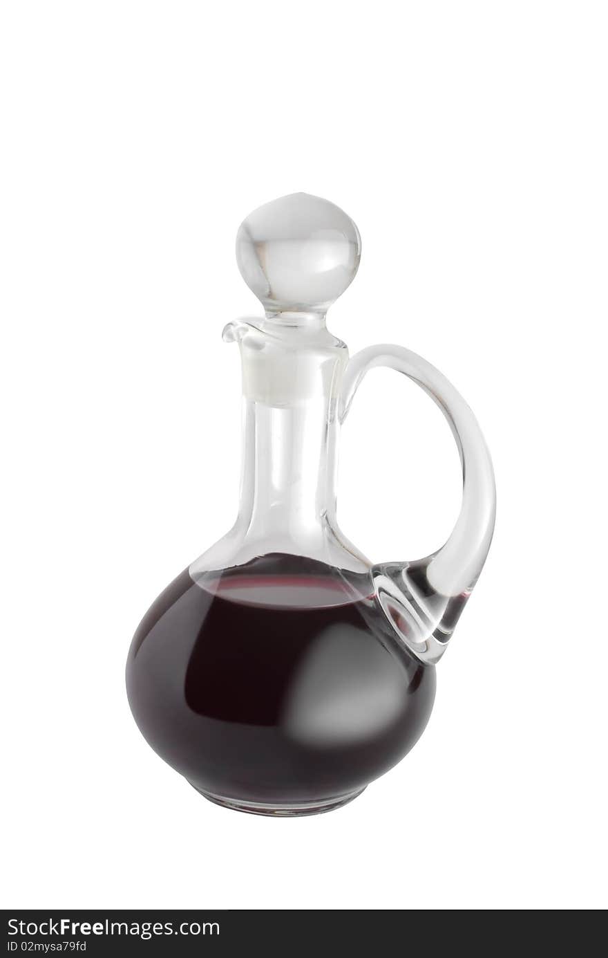 Red wine in glass decanter. Isolated on white background. Red wine in glass decanter. Isolated on white background.