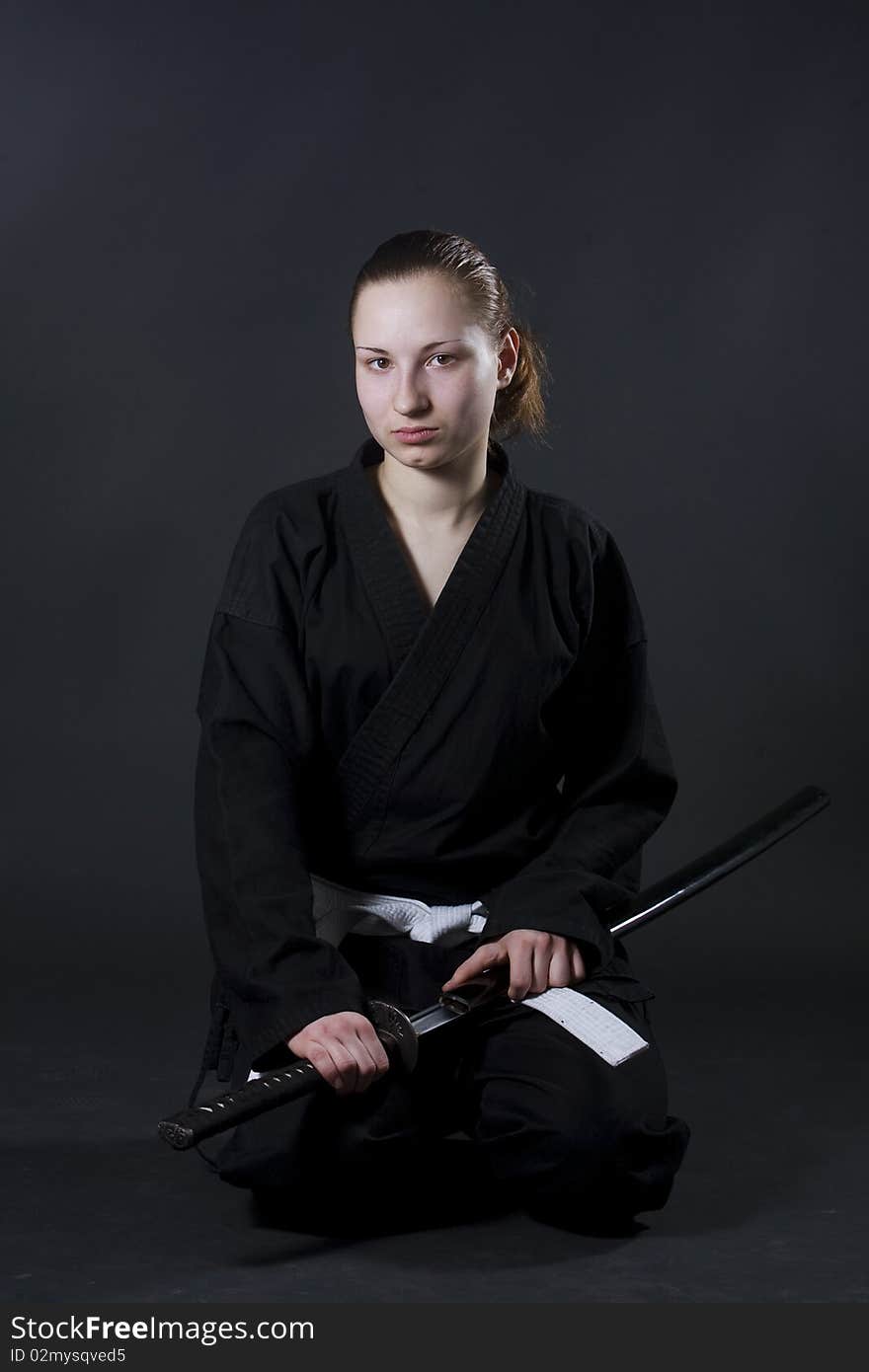 Portrait of female samurai holding katana