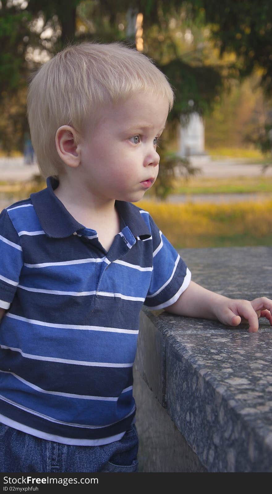 Portrait or young adorable child against park. Portrait or young adorable child against park