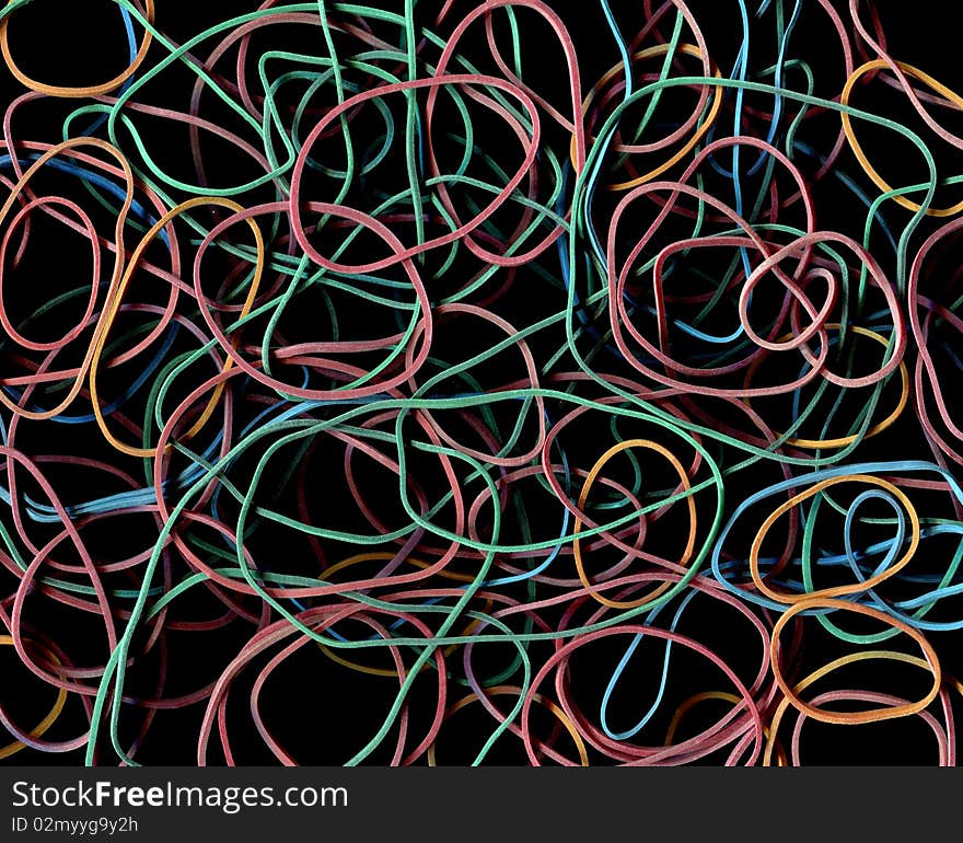 Closeup abstract rubber band in mess isolated