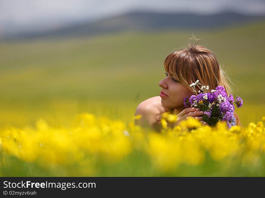 The girl with a bunch of flowers