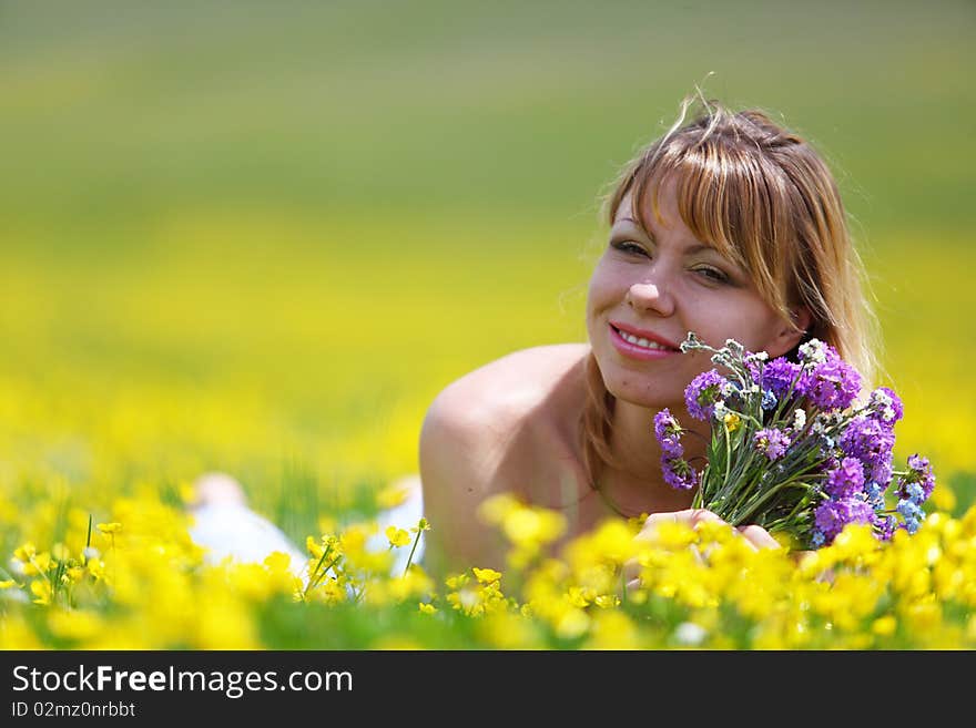 The girl with a bunch of flowers