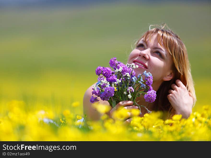 The girl with a bunch of flowers