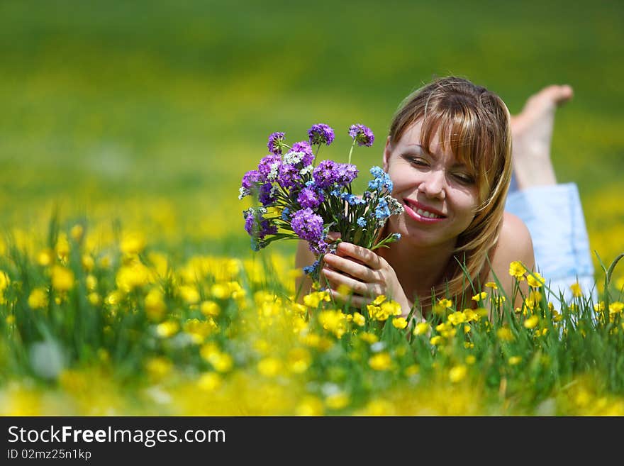 The girl with a bunch of flowers