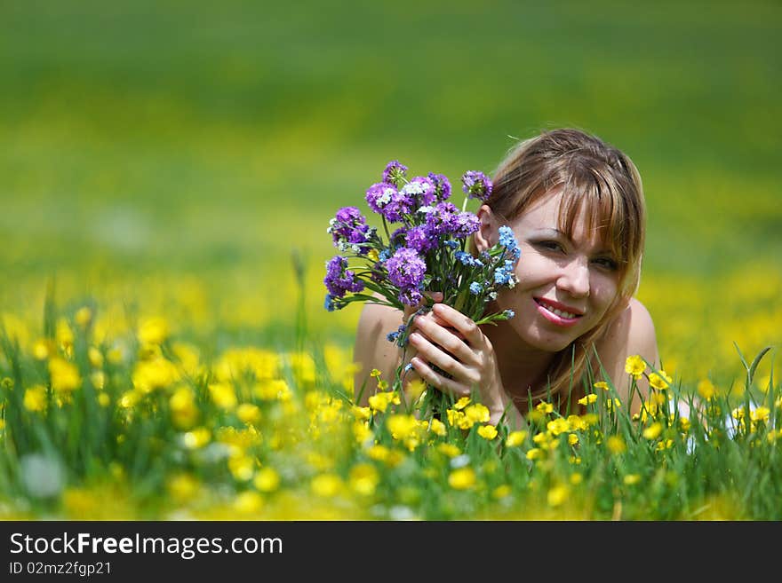 The girl with a bunch of flowers