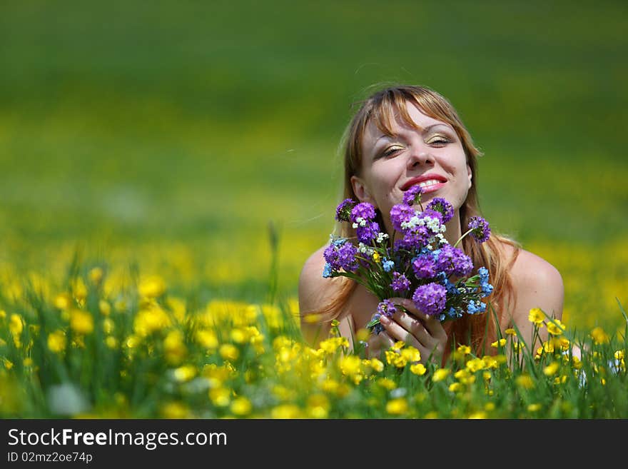 The girl with a bunch of flowers