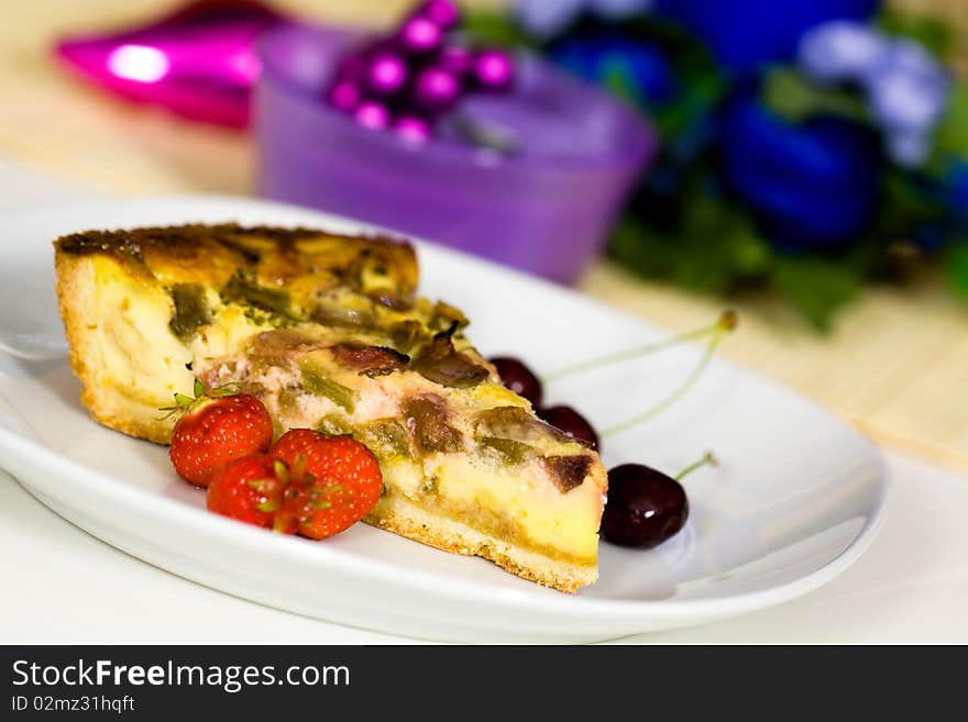 Fresh rhubarb cake with strawberry and cherry