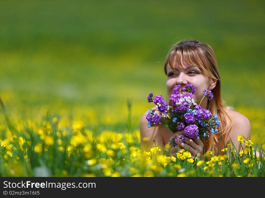 The girl with a bunch of flowers