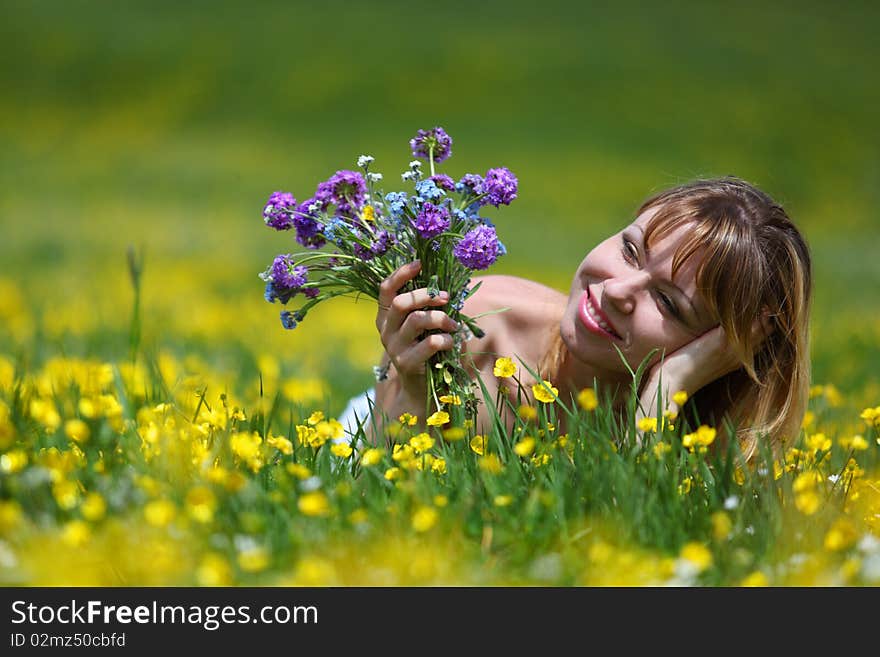 The girl with a bunch of flowers