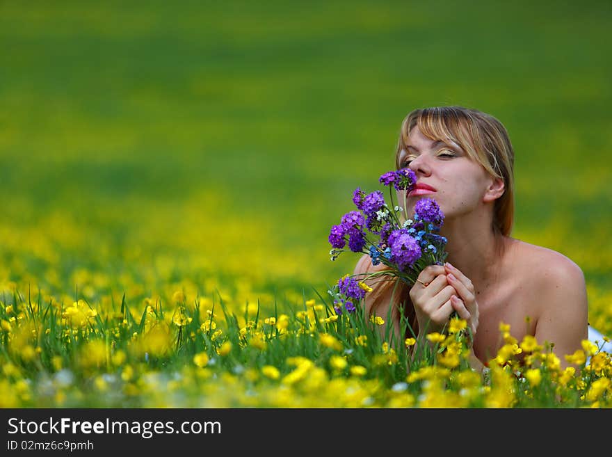 The girl with a bunch of flowers