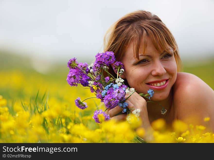 The girl with a bunch of flowers