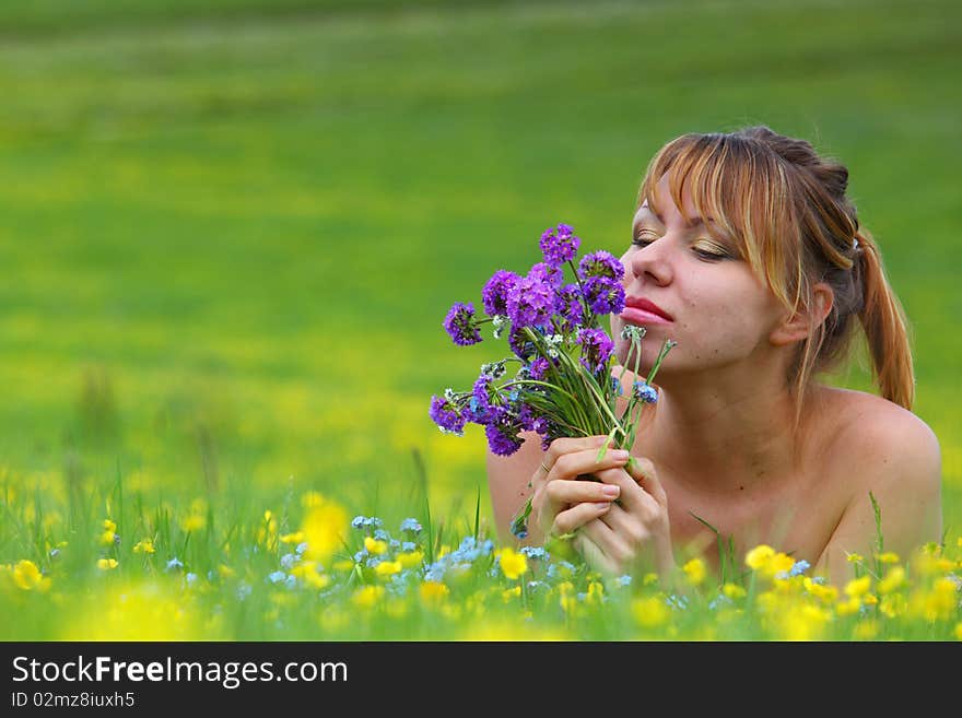 The girl with a bunch of flowers