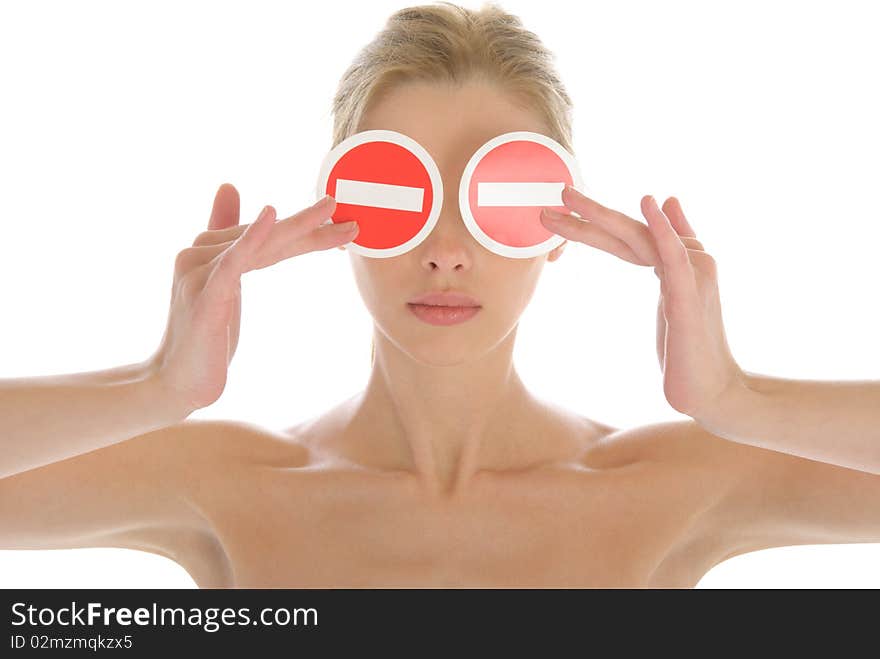 Woman holds two prohibiting signs before eyes isolated in white