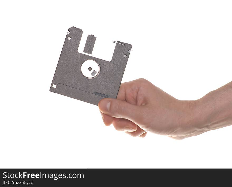 Hand with a floppy disk isolated on white background