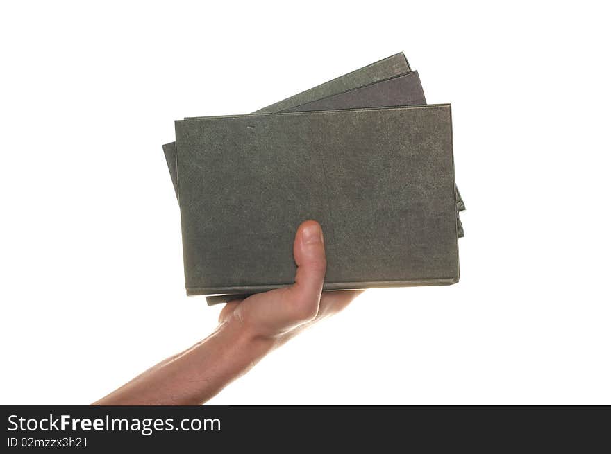 Hand with books isolated over white