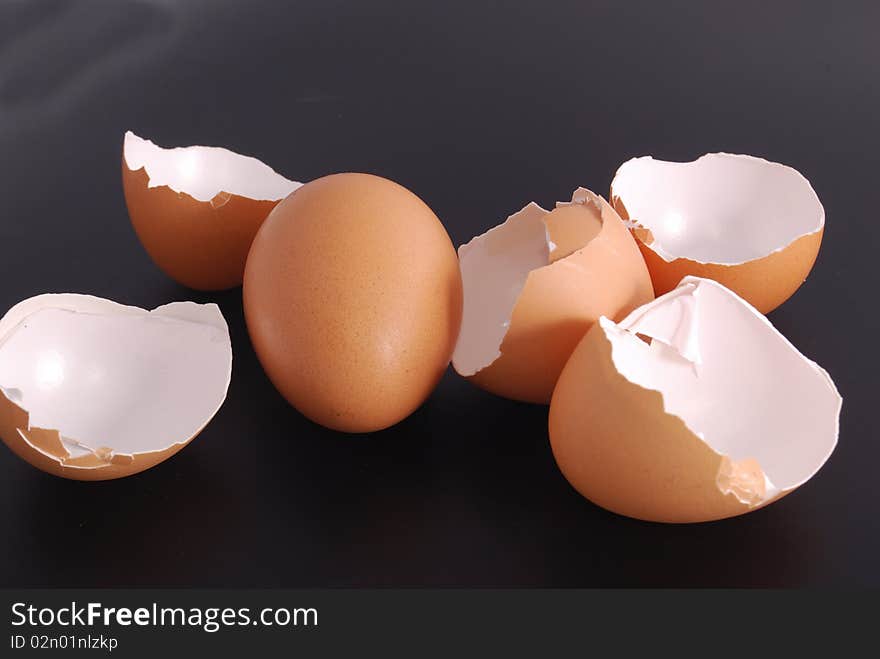 Broken egg shell isolated on black background