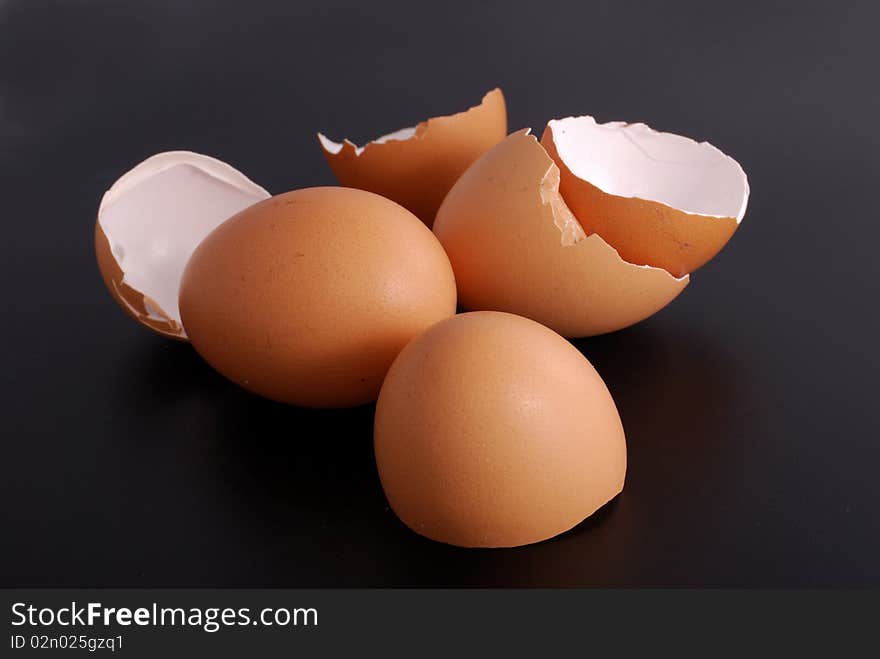 Broken egg shell isolated on black background