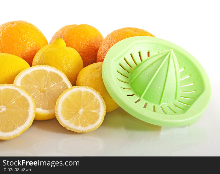 Fruits with squeezer , isolated on white background