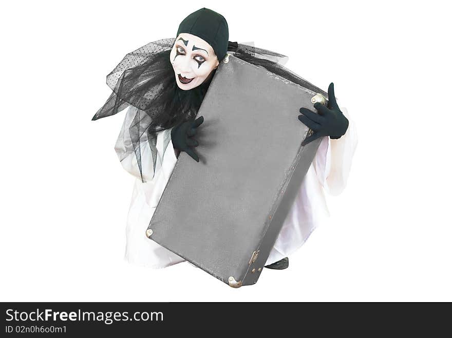 Sitting black and white pierrot with grey suitcase in hands overwhite. Sitting black and white pierrot with grey suitcase in hands overwhite