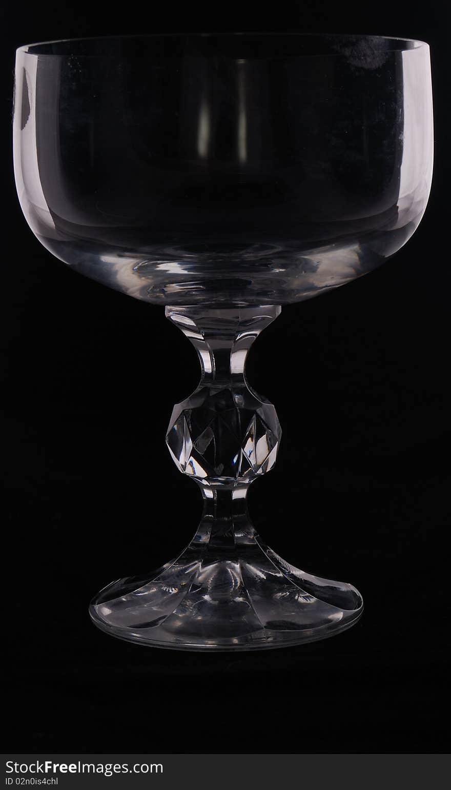 Low key shot of a wine glass against a black background