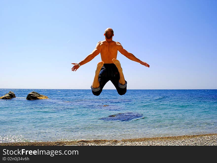 Man is jumping on the beach. Man is jumping on the beach